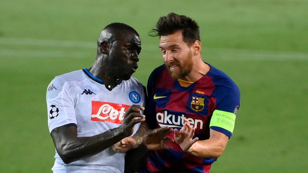 Kalidou Koulibaly battling against Lionel Messi for the possession of the ball. 