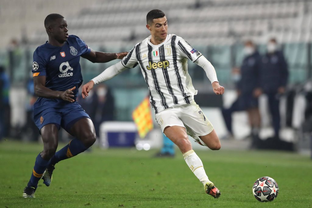 Malang Sarr of FC Porto challenges Cristiano Ronaldo of Juventus during a UEFA Champions League match. 