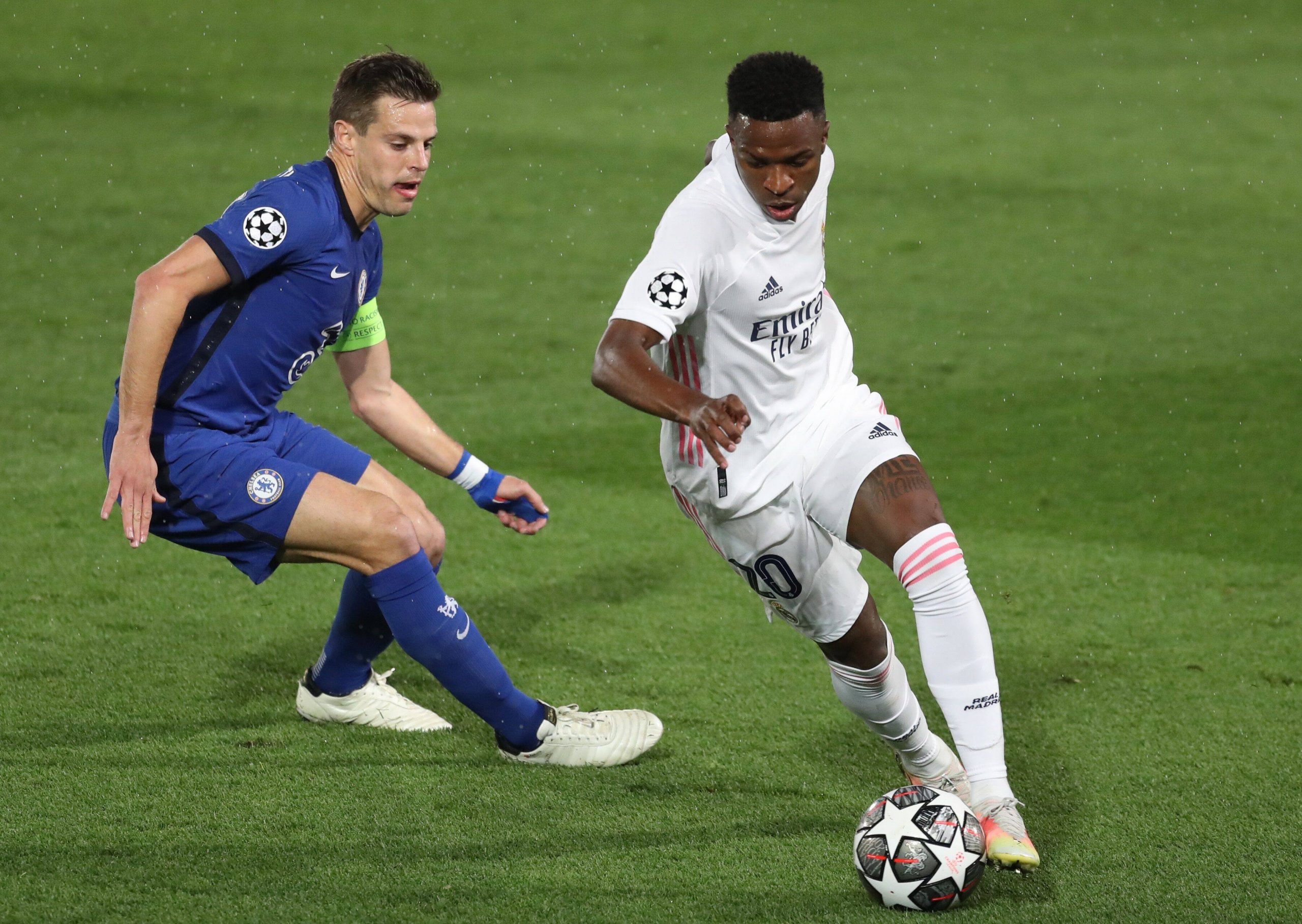 Madrid s Vinicius Jr (R) vies for the ball against Chelsea s Cesar Azpilicueta (L) during the UEFA Champions League firs