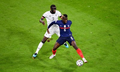 Antonio Rudiger of Chelsea and Germany vies for the ball with Paul Pogba of France and Manchester United.