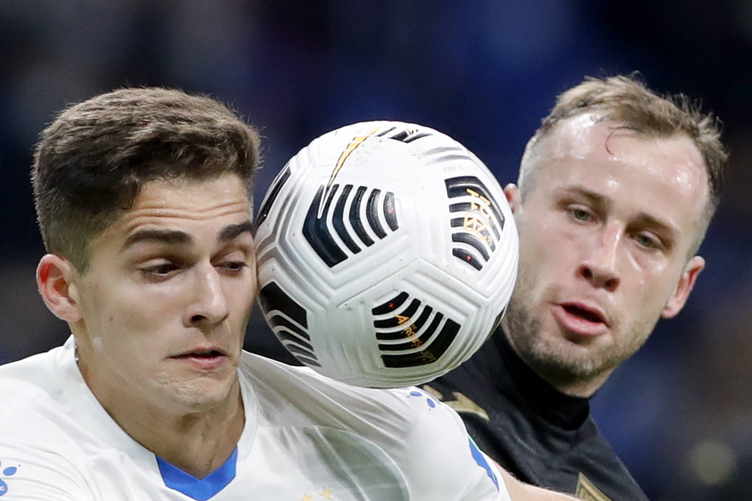 MOSCOW, RUSSIA   APRIL 3, 2021: Dynamo Moscow s Arsen Zakharyan (L) and FC Ufa s Filip Mrzljak head the ball in a 2020/2