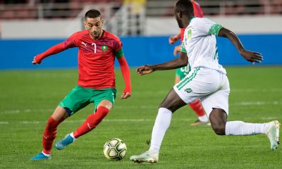 Morocco's midfielder Hakim Ziyech vies for the ball with Mauritania's Hacen El Ide