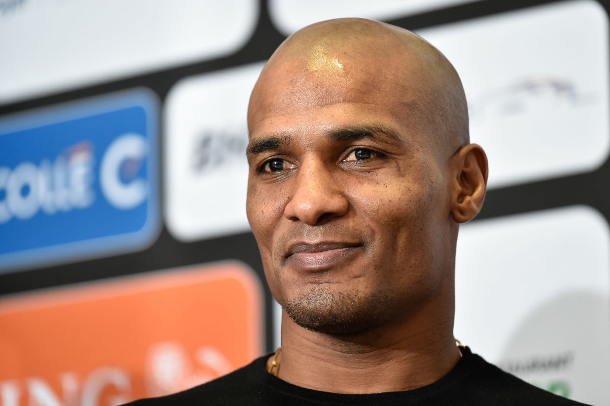 Florent Malouda looks on during a press conference.