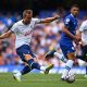 Harry Kane of Tottenham Hotspur kicks the ball as Thiago Silva watches on.