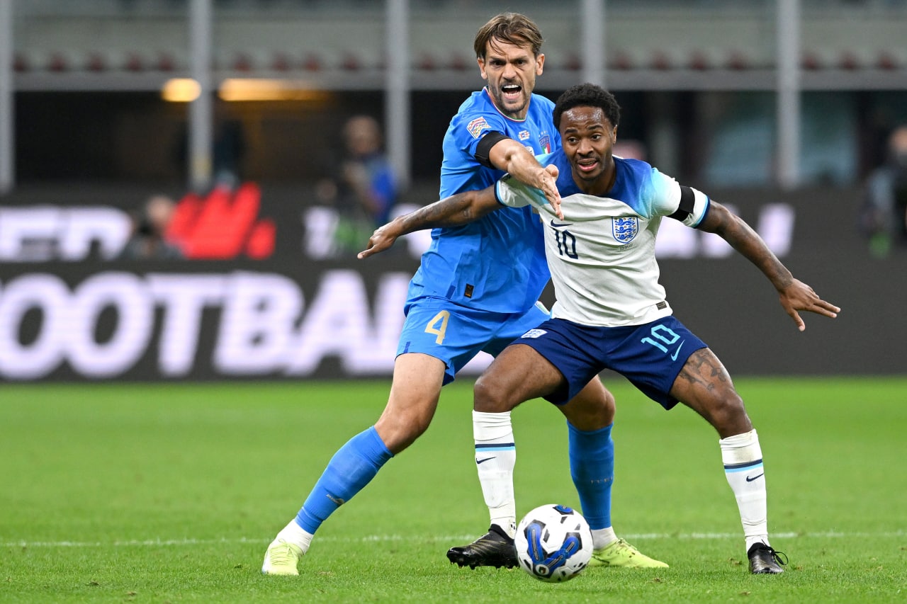 Rafael Toloi of Italy challenges Raheem Sterling of England during the UEFA Nations League League A Group 3 match between Italy and England at San Siro on September 23, 2022 in Milan, Italy. (Photo by Claudio Villa/Getty Images)