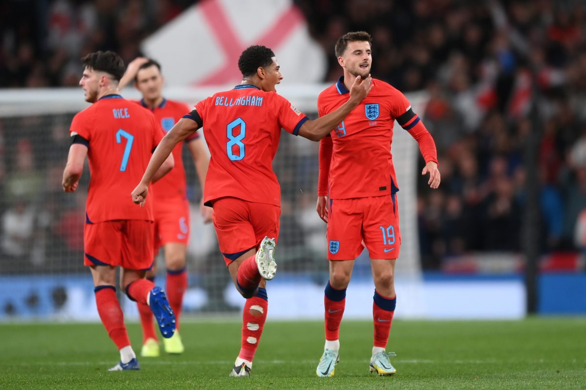 Mason Mount of England and Chelsea celebrates with teammate Jude Bellingham after scoring against Germany as Declan Rice is seen in the background.