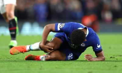 Chelsea's Wesley Fofana lays injured after a knee injury against AC Milan in October 2022.
