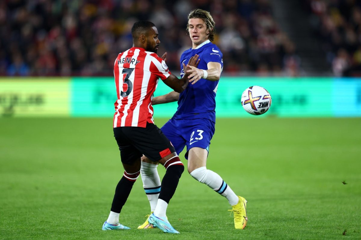 Conor GallaghConor Gallagher of Chelsea battles for possession with Rico Henry of Brentford. er of Chelsea battles for possession with Rico Henry of Brentford during the Premier League match between Brentford FC and Chelsea FC at Brentford Community Stadium on October 19, 2022 in Brentford, England. (Photo by Clive Rose/Getty Images)