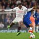 AC Milan's Rafael Leao fights for the ball with Chelsea's Wesley Fofana during a UEFA Champions League match in October 2022 at Stamford Bridge.