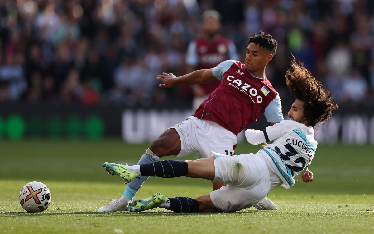 Ollie Watkins of Aston Villa battles for possession with Marc Cucurella of Chelsea. 