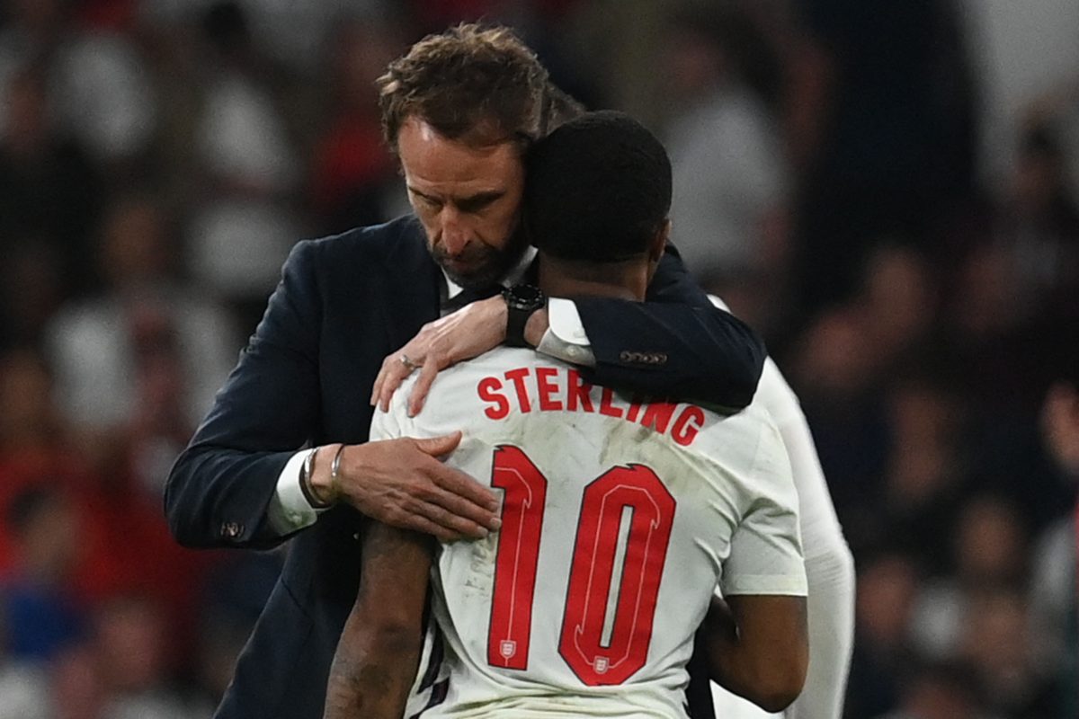 England's Gareth Southgate embraces Chelsea's Raheem Sterling after the UEFA EURO 2020 final.