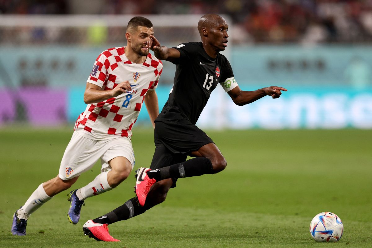 Croatia's Mateo Kovacic and Canada's Atiba Hutchinson fight for the ball. (Photo by ADRIAN DENNIS/AFP via Getty Images)