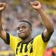 Youssoufa Moukoko celebrates for Borussia Dortmund.