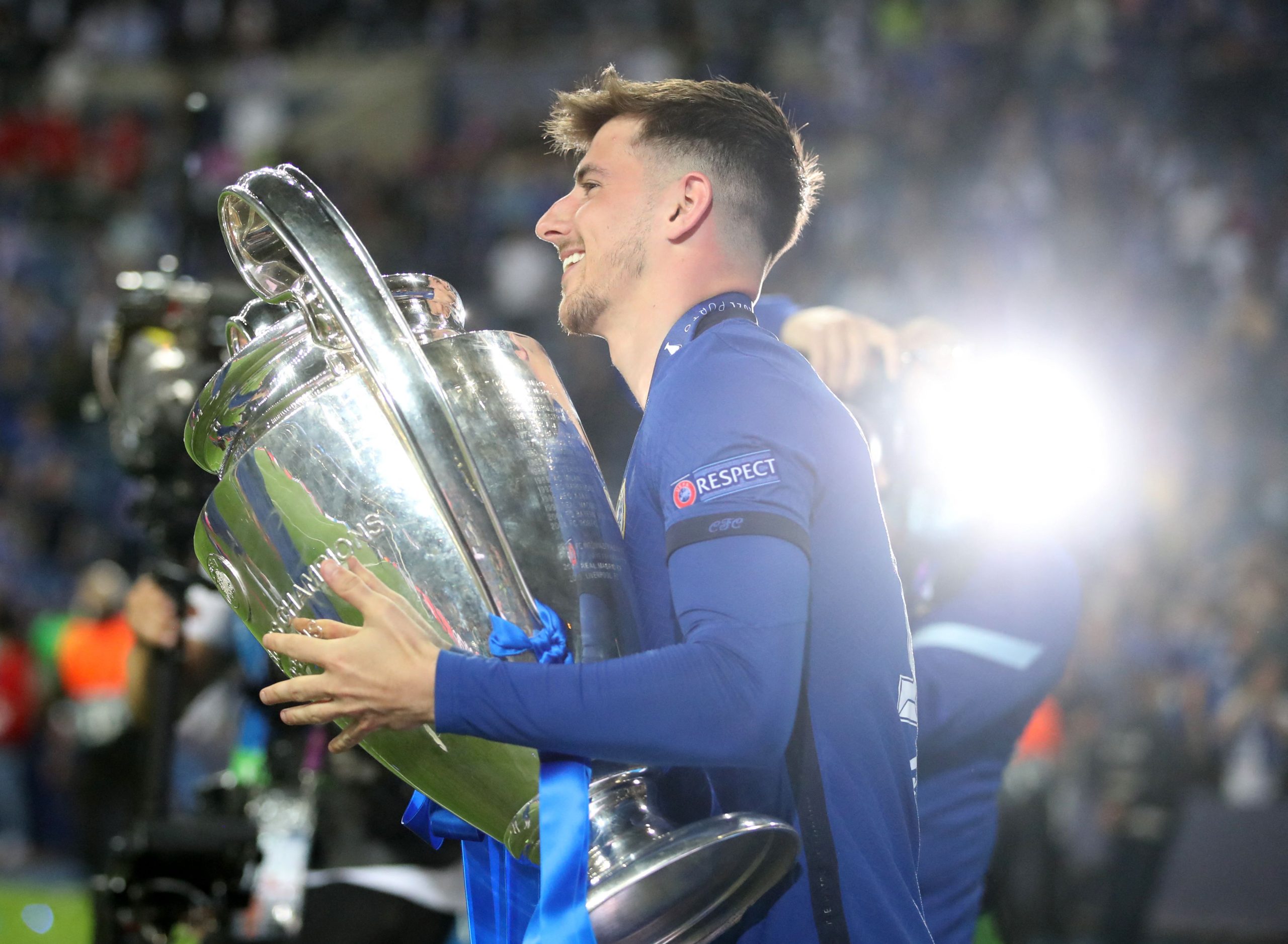 Chelsea's English midfielder Mason Mount holds the Champions League trophy after Chelsea won the UEFA Champions League final football match between Manchester City and Chelsea at the Dragao stadium in Porto on May 29, 2021