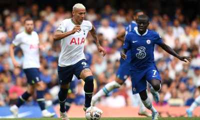 Richarlison of Tottenham Hotspur is challenged by N'Golo Kante of Chelsea.