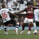 Marinho (R) of Flamengo competes for the ball with Andrey dos Santos of Vasco da Gama.