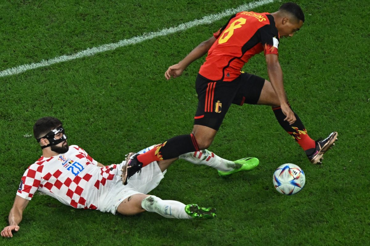 Josko Gvardiol fights for the ball with Belgium's Youri Tielemans. (Photo by MANAN VATSYAYANA/AFP via Getty Images)