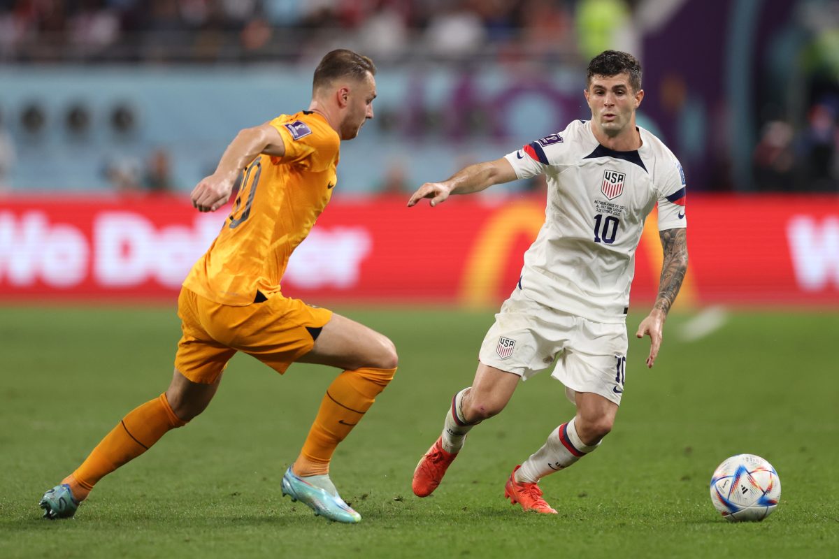 Teun Koopmeiners of Netherlands and Christian Pulisic of United States during Holland's 3-1 win in the 2022 FIFA World Cup last 16.