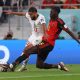 Belgium's Amadou Onana fights for the ball with Morocco's Sofiane Boufal.
