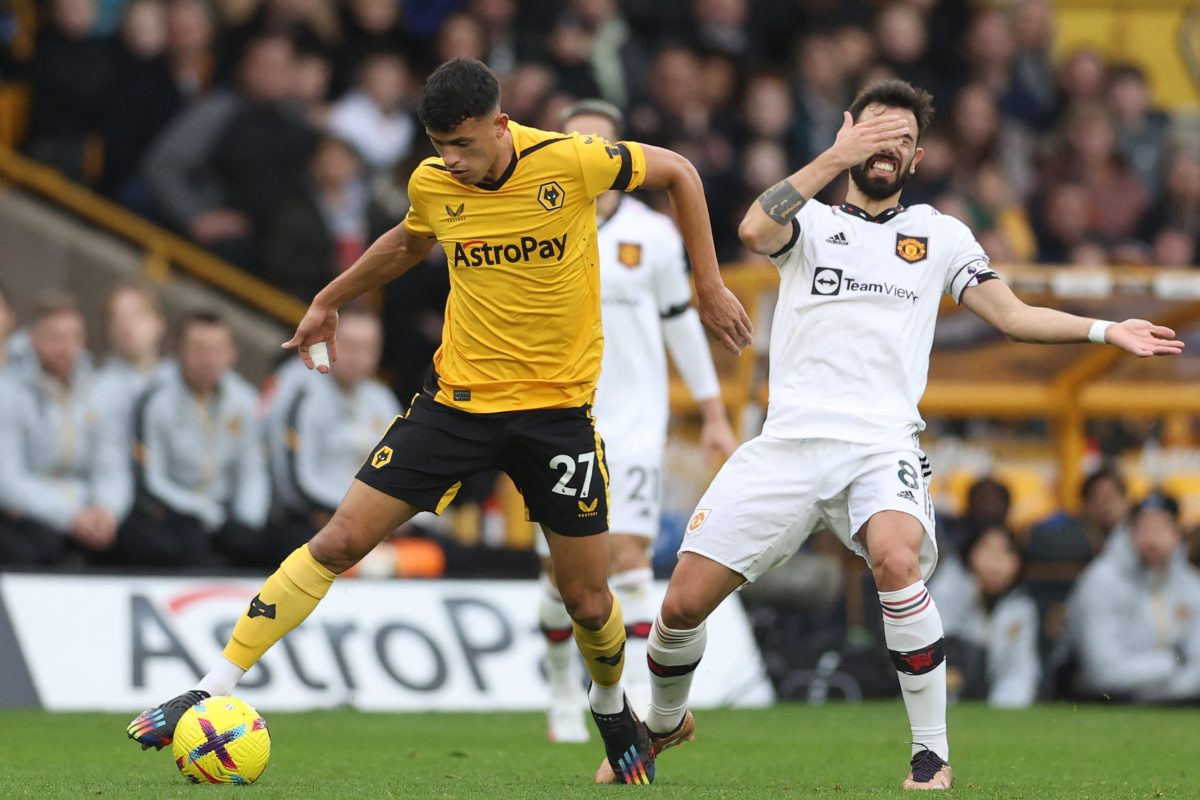 Wolverhampton Wanderers' Brazilian midfielder Matheus Nunes (L) vies with Manchester United's Portuguese midfielder Bruno Fernandes (R) during the English Premier League football match between Wolverhampton Wanderers and Manchester United at the Molineux stadium in Wolverhampton, central England on December 31, 2022. - RESTRICTED TO EDITORIAL USE. No use with unauthorized audio, video, data, fixture lists, club/league logos or 'live' services. Online in-match use limited to 120 images. An additional 40 images may be used in extra time. No video emulation. Social media in-match use limited to 120 images. An additional 40 images may be used in extra time. No use in betting publications, games or single club/league/player publications. (Photo by ADRIAN DENNIS / AFP) / RESTRICTED TO EDITORIAL USE. No use with unauthorized audio, video, data, fixture lists, club/league logos or 'live' services. Online in-match use limited to 120 images. An additional 40 images may be used in extra time. No video emulation. Social media in-match use limited to 120 images. An additional 40 images may be used in extra time. No use in betting publications, games or single club/league/player publications. / RESTRICTED TO EDITORIAL USE. No use with unauthorized audio, video, data, fixture lists, club/league logos or 'live' services. Online in-match use limited to 120 images. An additional 40 images may be used in extra time. No video emulation. Social media in-match use limited to 120 images. An additional 40 images may be used in extra time. No use in betting publications, games or single club/league/player publications