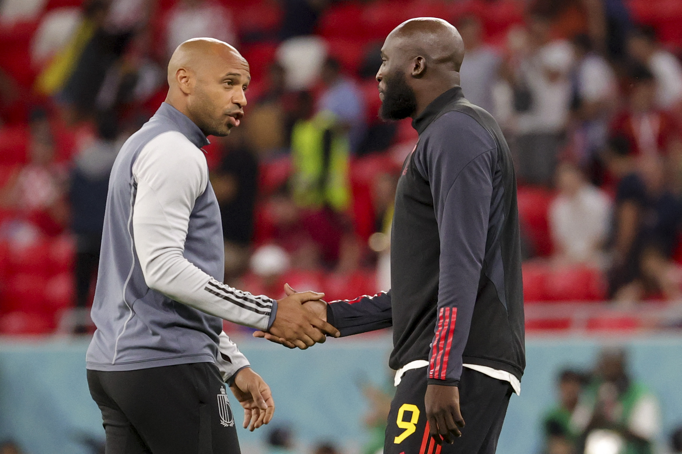 Belgium's assistant coach Thierry Henry and Romelu Lukaku.