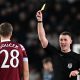 Referee Thomas Bramall shows a yellow card to West Ham United's Czech midfielder Tomas Soucekagainst Chelsea. (Photo by PAUL ELLIS/AFP via Getty Images)