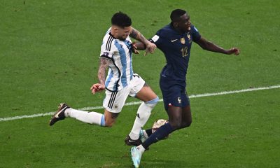 Argentina's defender Nicolas Otamendi fights for the ball with France's Randal Kolo Muani during the Qatar 2022 World Cup final.