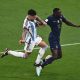 Argentina's defender Nicolas Otamendi fights for the ball with France's Randal Kolo Muani during the Qatar 2022 World Cup final.