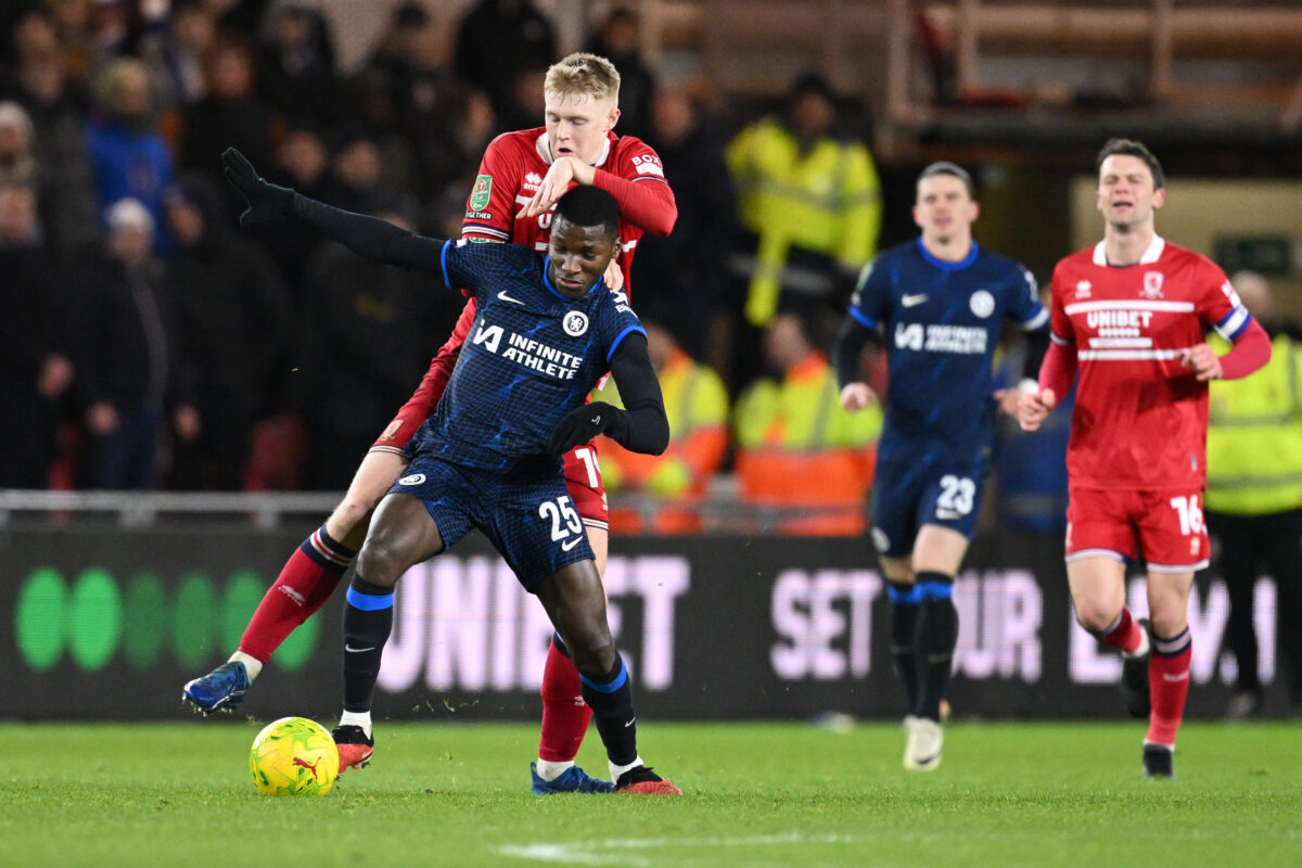 Chelsea's Ecuadorian midfielder #25 Moises Caicedo (front L) fights for the ball with Middlesbrough's English striker #19 Josh Coburn (rear L) during the English League Cup first-leg semi-final football match between Middlesbrough and Chelsea at the Riverside Stadium in Middlesbrough, northeast England on January 9, 2024. (Photo by OLI SCARFF/AFP via Getty Images)